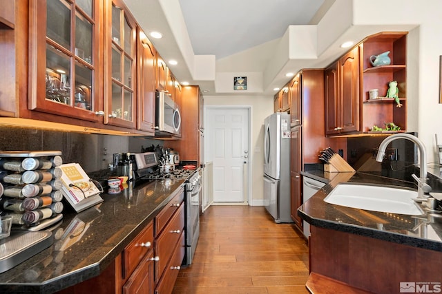 400 Fairview Blvd Unit 155, Incline Village, NV 89451 - kitchen featuring stainless steel appliances, a sink, dark wood finished floors, dark stone counters, and recessed lighting
