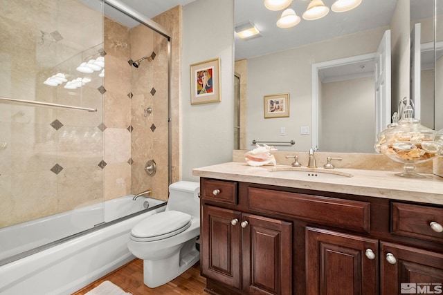 400 Fairview Blvd Unit 155, Incline Village, NV 89451 - bathroom with toilet, wood finished floors, vanity, and bath / shower combo with glass door