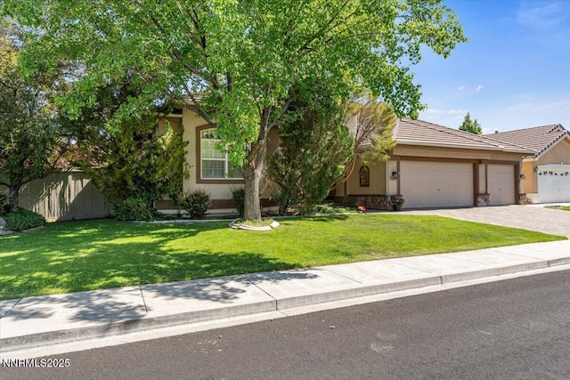 1556 Diamond Country Dr, Reno, NV 89521 - obstructed view of property with stucco siding, an attached garage, driveway, and a tiled roof