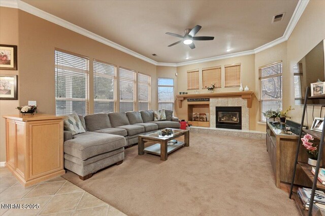 1556 Diamond Country Dr, Reno, NV 89521 - living room with ceiling fan, crown molding, a tiled fireplace, light tile patterned floors, and recessed lighting