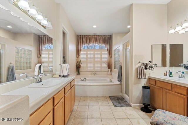1556 Diamond Country Dr, Reno, NV 89521 - full bathroom with a bath, two vanities, a stall shower, recessed lighting, and tile patterned flooring