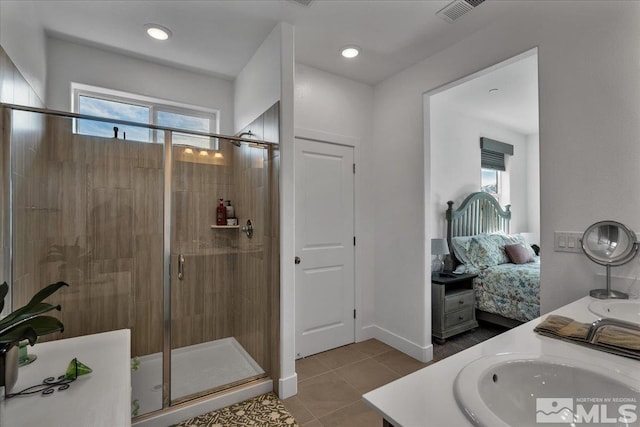 3631 Pulsar Ln Unit 1, Carson City, NV 89705 - bathroom featuring a shower stall, double vanity, and tile patterned floors