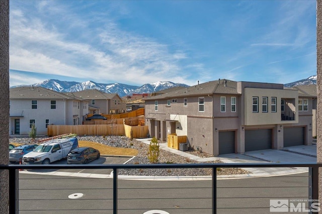 3631 Pulsar Ln Unit 1, Carson City, NV 89705 - view of front facade featuring a residential view, a mountain view, a garage, stucco siding, and driveway