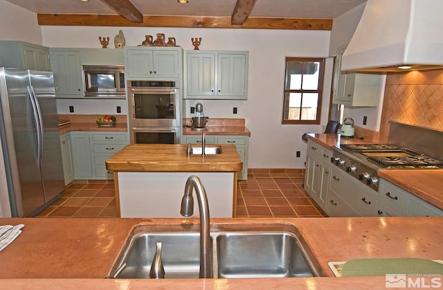 10 Dee Ct, Smith, NV 89430 - kitchen featuring stainless steel appliances, custom exhaust hood, butcher block counters, a sink, and light tile patterned floors