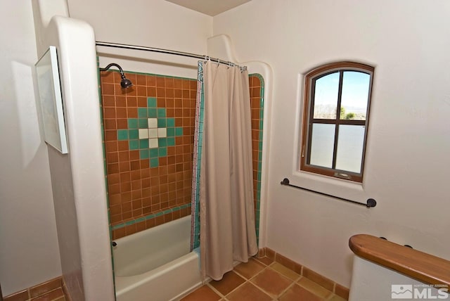 10 Dee Ct, Smith, NV 89430 - full bathroom featuring tile patterned floors, shower / tub combo with curtain, and baseboards