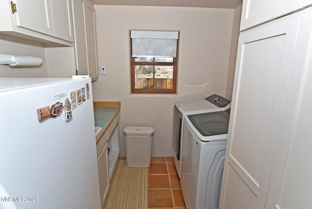 10 Dee Ct, Smith Valley, NV 89444 - washroom featuring washer and clothes dryer, cabinet space, and tile patterned floors