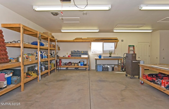 10 Dee Ct, Smith Valley, NV 89444 - garage featuring a workshop area and a garage door opener