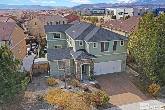 1950 Red Willow Dr, Reno, NV 89521 - traditional-style house featuring stucco siding, a mountain view, a residential view, and fence