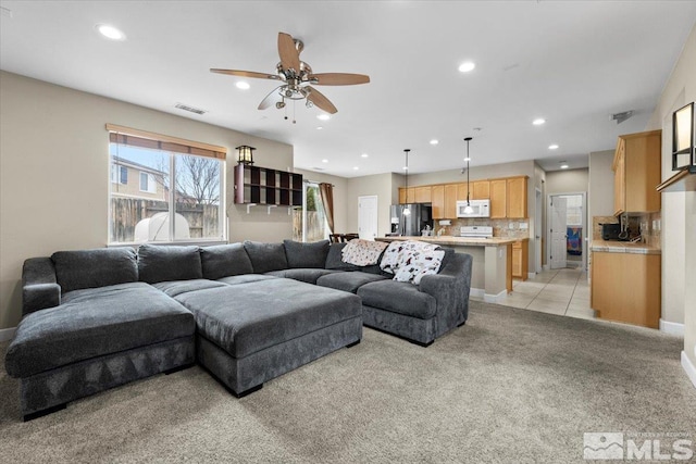 1950 Red Willow Dr, Reno, NV 89521 - living room featuring a ceiling fan, light carpet, recessed lighting, baseboards, and light tile patterned floors