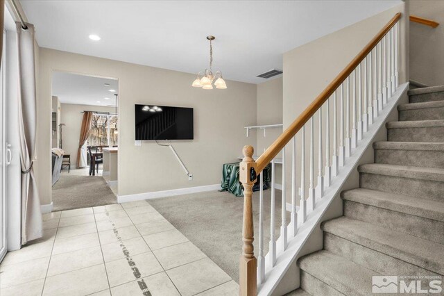 1950 Red Willow Dr, Reno, NV 89521 - stairway featuring carpet floors, recessed lighting, a chandelier, baseboards, and tile patterned flooring