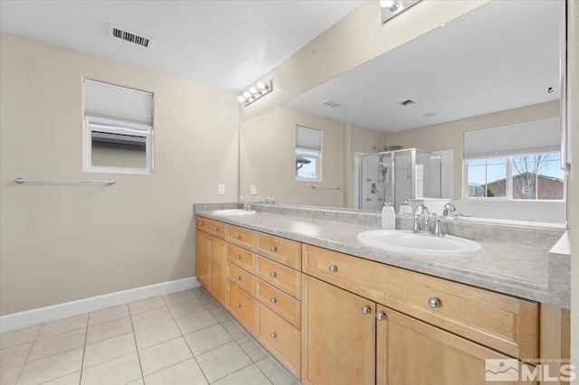 1950 Red Willow Dr, Reno, NV 89521 - full bath featuring a stall shower, tile patterned floors, baseboards, and double vanity