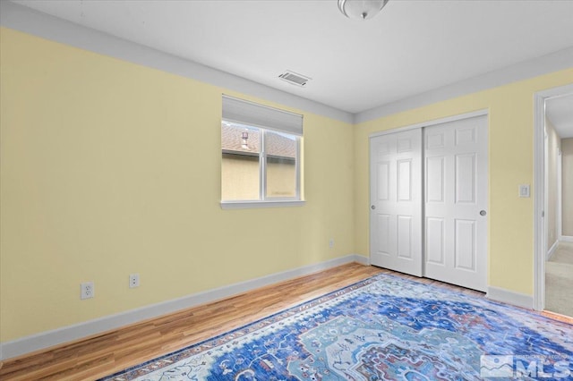 1950 Red Willow Dr, Reno, NV 89521 - unfurnished bedroom featuring wood finished floors, baseboards, and a closet