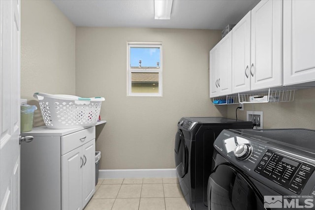 1950 Red Willow Dr, Reno, NV 89521 - laundry area featuring cabinet space, separate washer and dryer, baseboards, and light tile patterned flooring