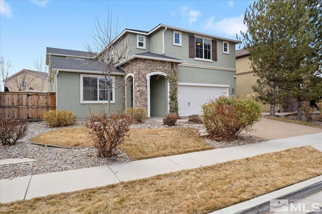 1950 Red Willow Dr, Reno, NV 89521 - traditional home featuring stucco siding, fence, a garage, stone siding, and driveway