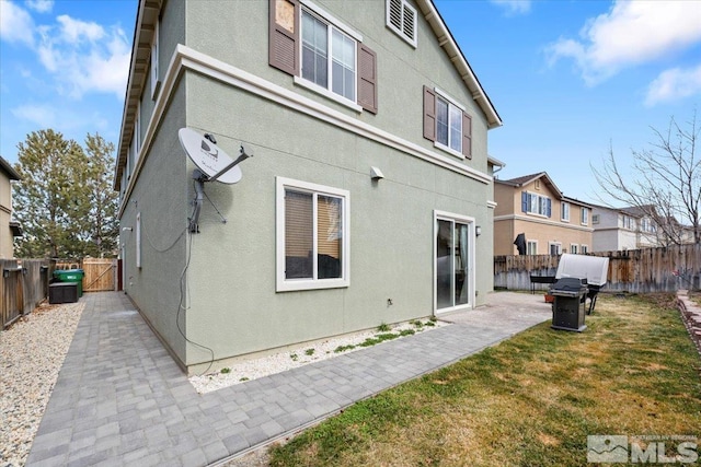 1950 Red Willow Dr, Reno, NV 89521 - back of property featuring a patio area, stucco siding, a gate, and a residential view