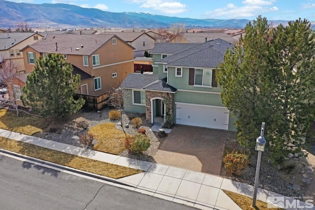1950 Red Willow Dr, Reno, NV 89521 - traditional-style house with stucco siding, a residential view, decorative driveway, a garage, and roof with shingles