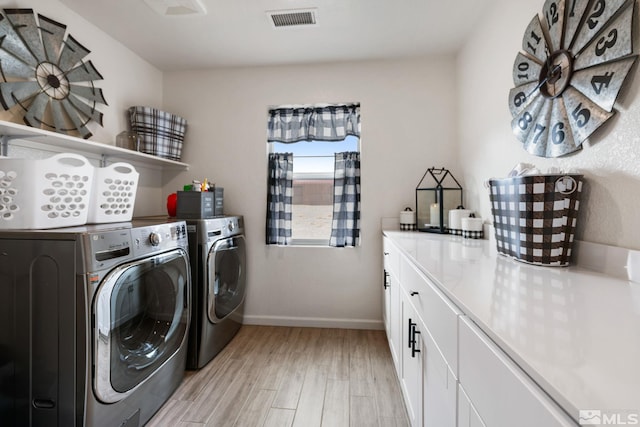 276 Greywall Ct, Dayton, NV 89403 - laundry area featuring separate washer and dryer, light wood finished floors, baseboards, and cabinet space
