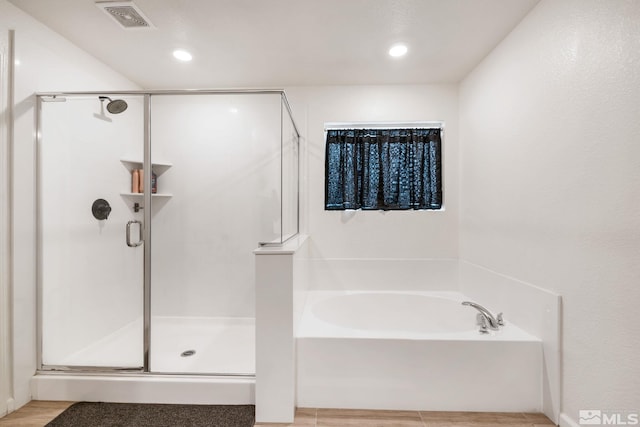276 Greywall Ct, Dayton, NV 89403 - bathroom featuring a garden tub, a shower stall, wood finished floors, and recessed lighting