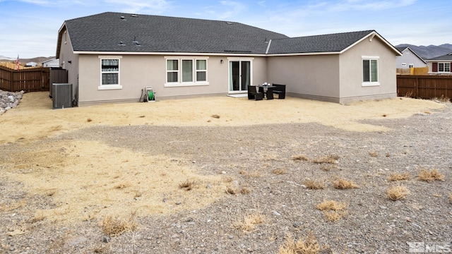 276 Greywall Ct, Dayton, NV 89403 - back of house with stucco siding, a fenced backyard, roof with shingles, and cooling unit