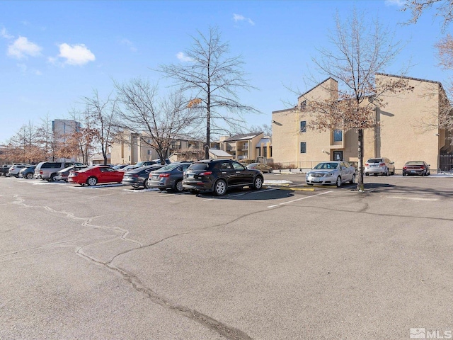 2450 Lymbery St Unit 213, Reno, NV 89509 - uncovered parking lot featuring a residential view
