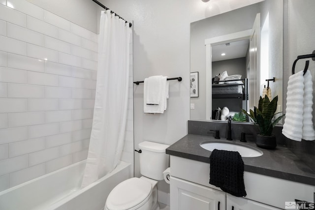 bathroom featuring vanity, toilet, and shower / bathtub combination with curtain