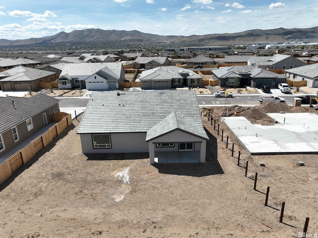 aerial view of residential area with a mountainous background