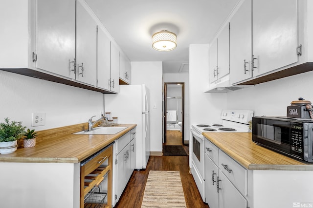 400 S Saliman Rd Unit G56, Carson City, NV 89701 - kitchen with black microwave, white electric stove, under cabinet range hood, a sink, and dark wood-type flooring