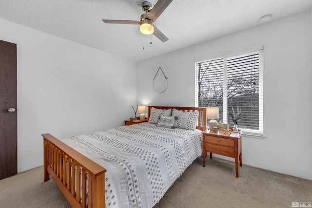 400 S Saliman Rd Unit G56, Carson City, NV 89701 - bedroom with carpet flooring, a textured ceiling, and a ceiling fan