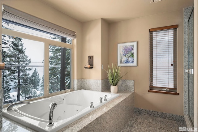 full bath featuring a jetted tub