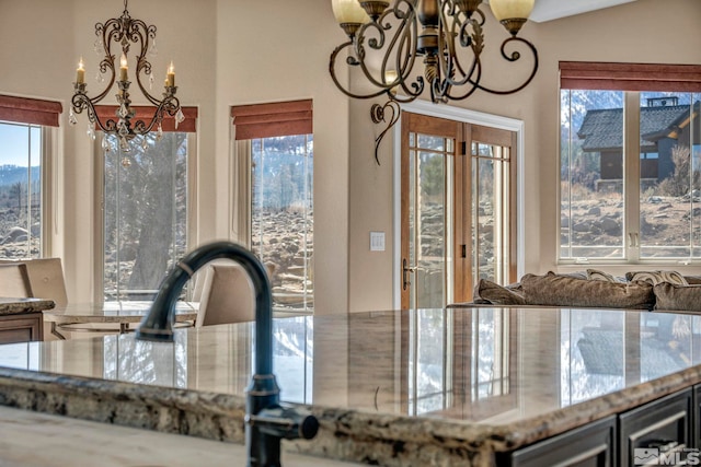 227 S Earlham, Reno, NV 89511 - kitchen featuring a chandelier, stone counters, and hanging light fixtures