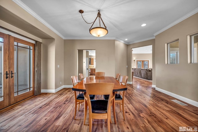 227 S Earlham, Reno, NV 89511 - dining room with french doors, wood finished floors, baseboards, crown molding, and recessed lighting