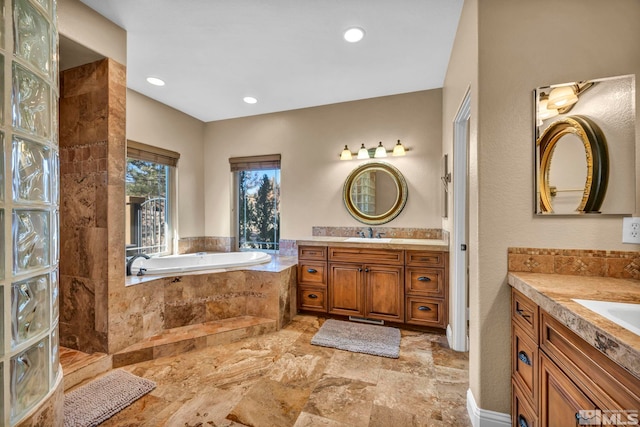 227 S Earlham, Reno, NV 89511 - bathroom with two vanities, a bath, recessed lighting, and stone finish flooring