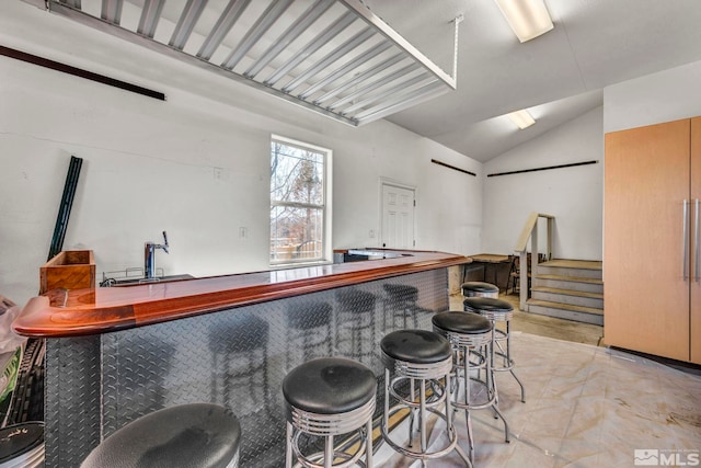 227 S Earlham, Reno, NV 89511 - indoor bar with vaulted ceiling, paneled built in refrigerator, and stairway