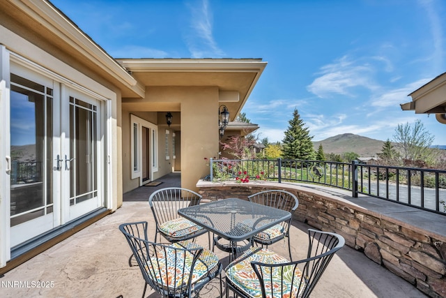 227 S Earlham, Reno, NV 89511 - view of patio / terrace with a mountain view, french doors, and outdoor dining area