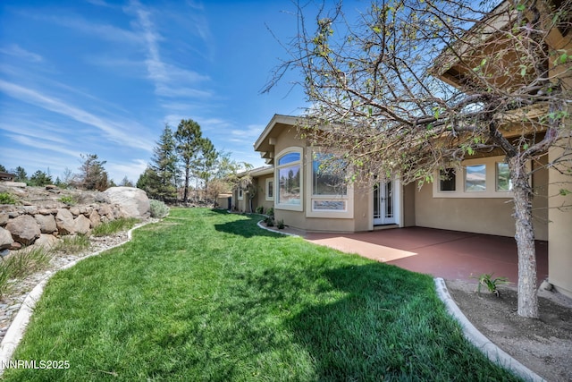 227 S Earlham, Reno, NV 89511 - view of green lawn with a patio area and french doors