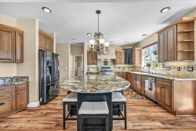 227 S Earlham, Reno, NV 89511 - kitchen with stainless steel appliances, open shelves, a chandelier, a kitchen breakfast bar, and a center island