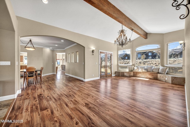 227 S Earlham, Reno, NV 89511 - living room with wood finished floors, arched walkways, baseboards, recessed lighting, and a chandelier