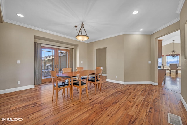 227 S Earlham, Reno, NV 89511 - dining area with wood finished floors, a chandelier, baseboards, ornamental molding, and recessed lighting
