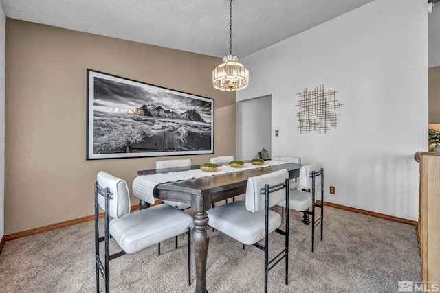 1663 Shadow Wood Ct, Reno, NV 89523 - carpeted dining space with a chandelier, a textured ceiling, and baseboards