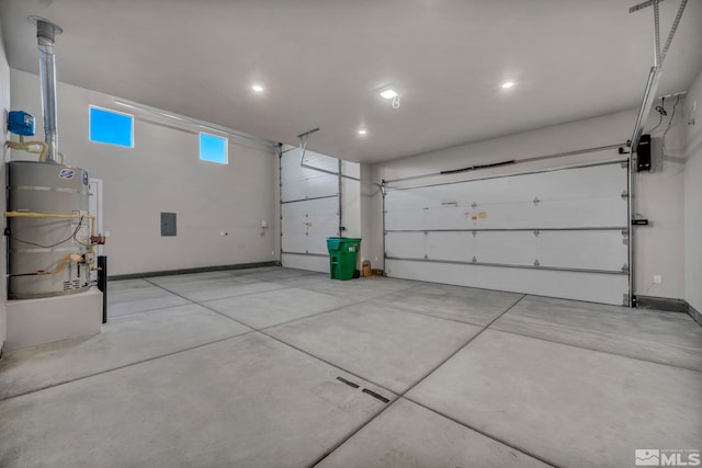 11651 Sugarloaf Peak Dr, Sparks, NV 89441 - garage featuring secured water heater, baseboards, and recessed lighting