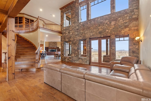525 Cable Canyon Way, Fernley, NV 89408 - living room featuring a high ceiling, hardwood / wood-style floors, plenty of natural light, stairway, and recessed lighting
