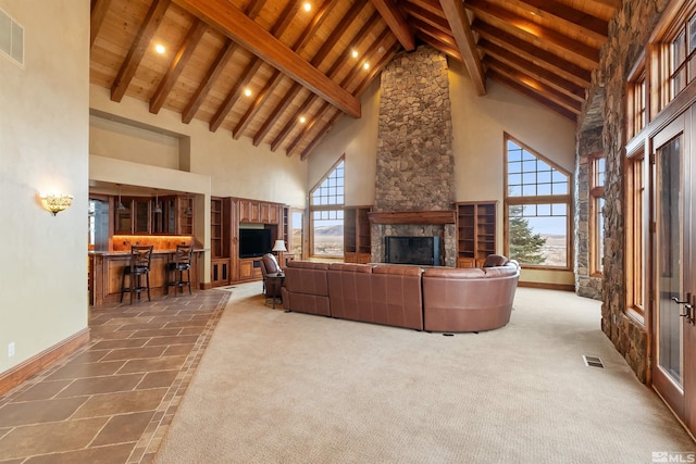 525 Cable Canyon Way, Fernley, NV 89408 - living area with high vaulted ceiling, wood ceiling, a fireplace, beamed ceiling, and baseboards