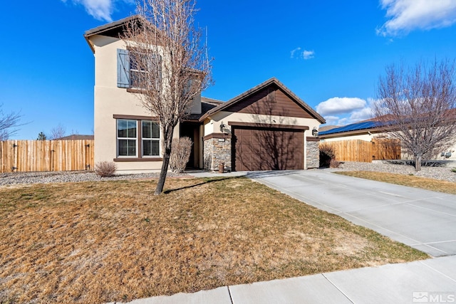 2780 Tobiano Dr, Reno, NV 89521 - view of front facade featuring an attached garage, concrete driveway, stucco siding, stone siding, and a gate