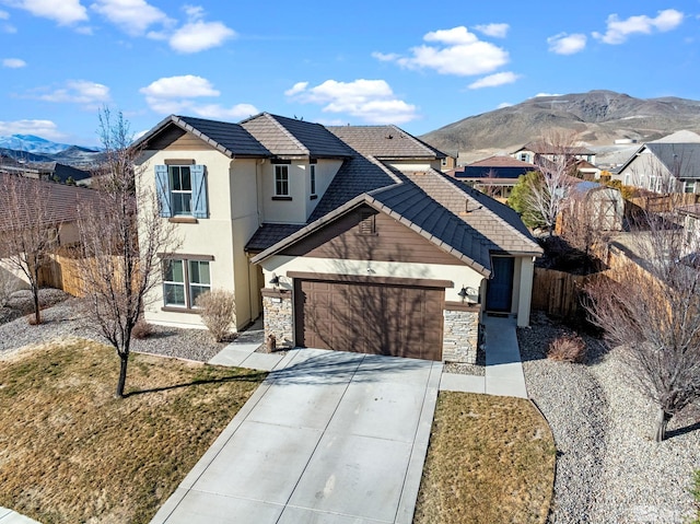2780 Tobiano Dr, Reno, NV 89521 - traditional home featuring fence, driveway, a tiled roof, stucco siding, and a garage