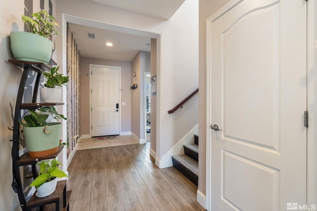 2780 Tobiano Dr, Reno, NV 89521 - entryway with light wood finished floors, baseboards, recessed lighting, and stairs