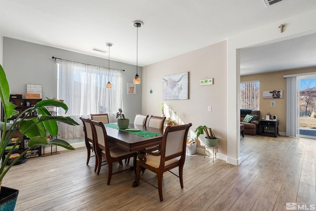 2780 Tobiano Dr, Reno, NV 89521 - dining room with light wood finished floors and baseboards