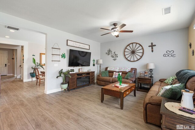 2780 Tobiano Dr, Reno, NV 89521 - living area featuring ceiling fan, light wood-style floors, and baseboards