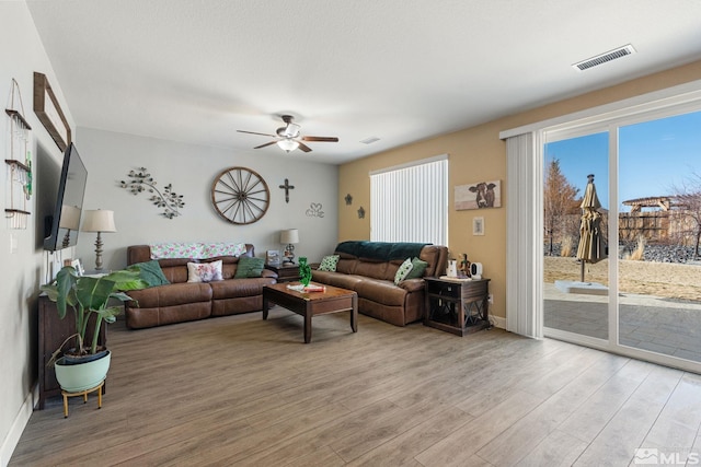 2780 Tobiano Dr, Reno, NV 89521 - living area featuring light wood-style flooring, ceiling fan, and baseboards
