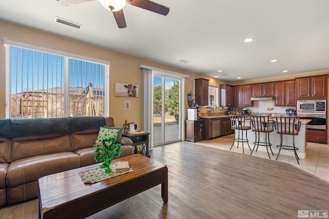 2780 Tobiano Dr, Reno, NV 89521 - living room with a ceiling fan, recessed lighting, and light wood-style floors