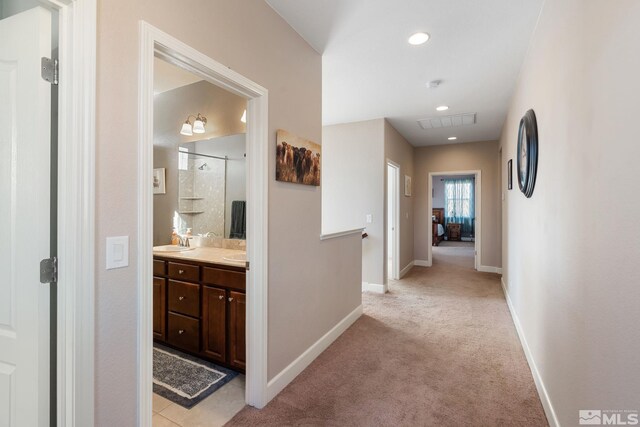 2780 Tobiano Dr, Reno, NV 89521 - corridor featuring light colored carpet, baseboards, recessed lighting, and a sink